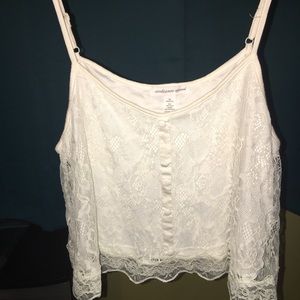 Flowy white lace crop top with adjustable straps